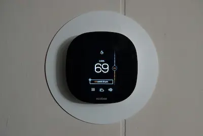 Smart thermostat on a wall
